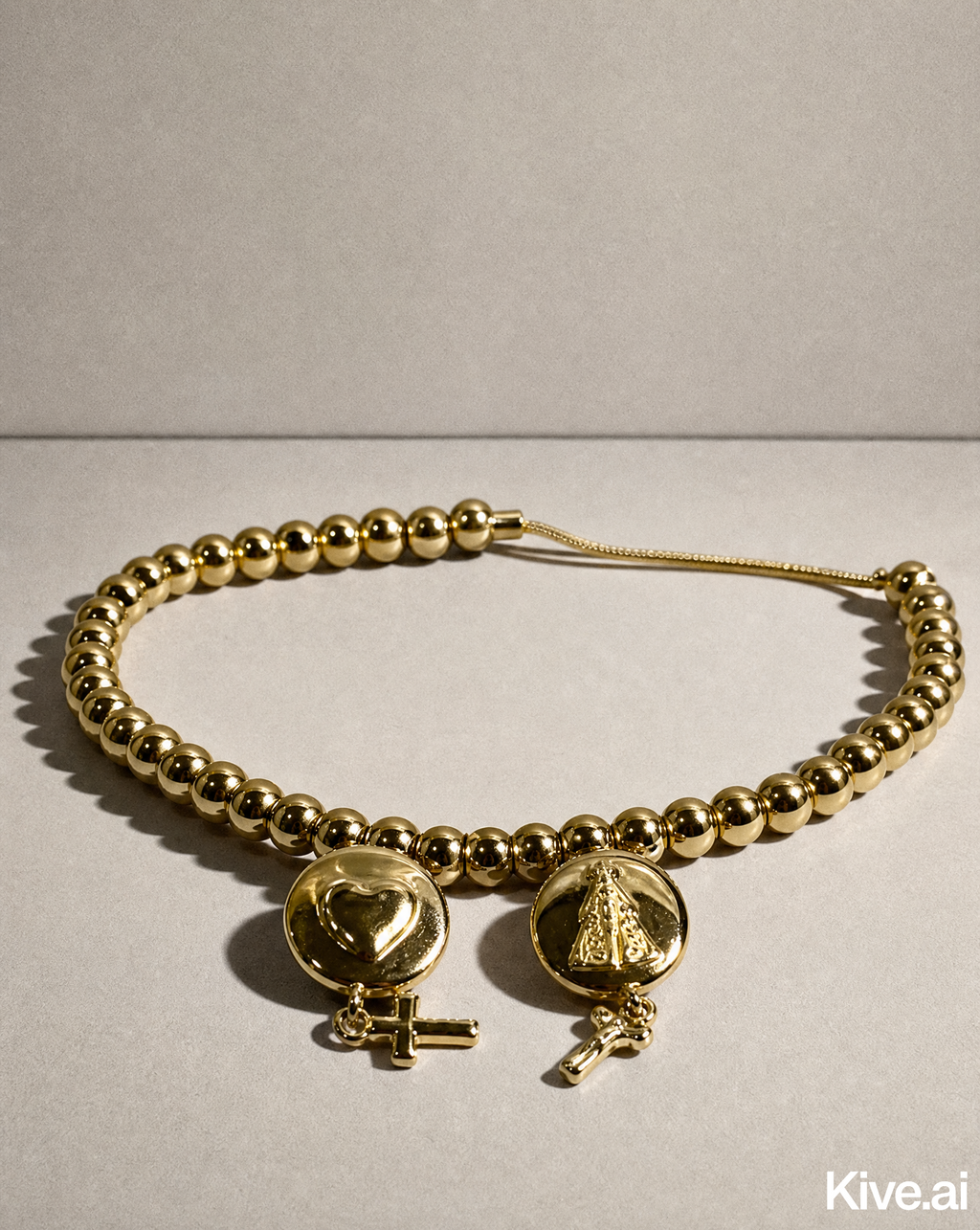 Armband — Kruisbedeltjes, goud